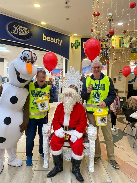 Lions Club volunteers with Santa Claus during Christmas Food and Toy Appeal