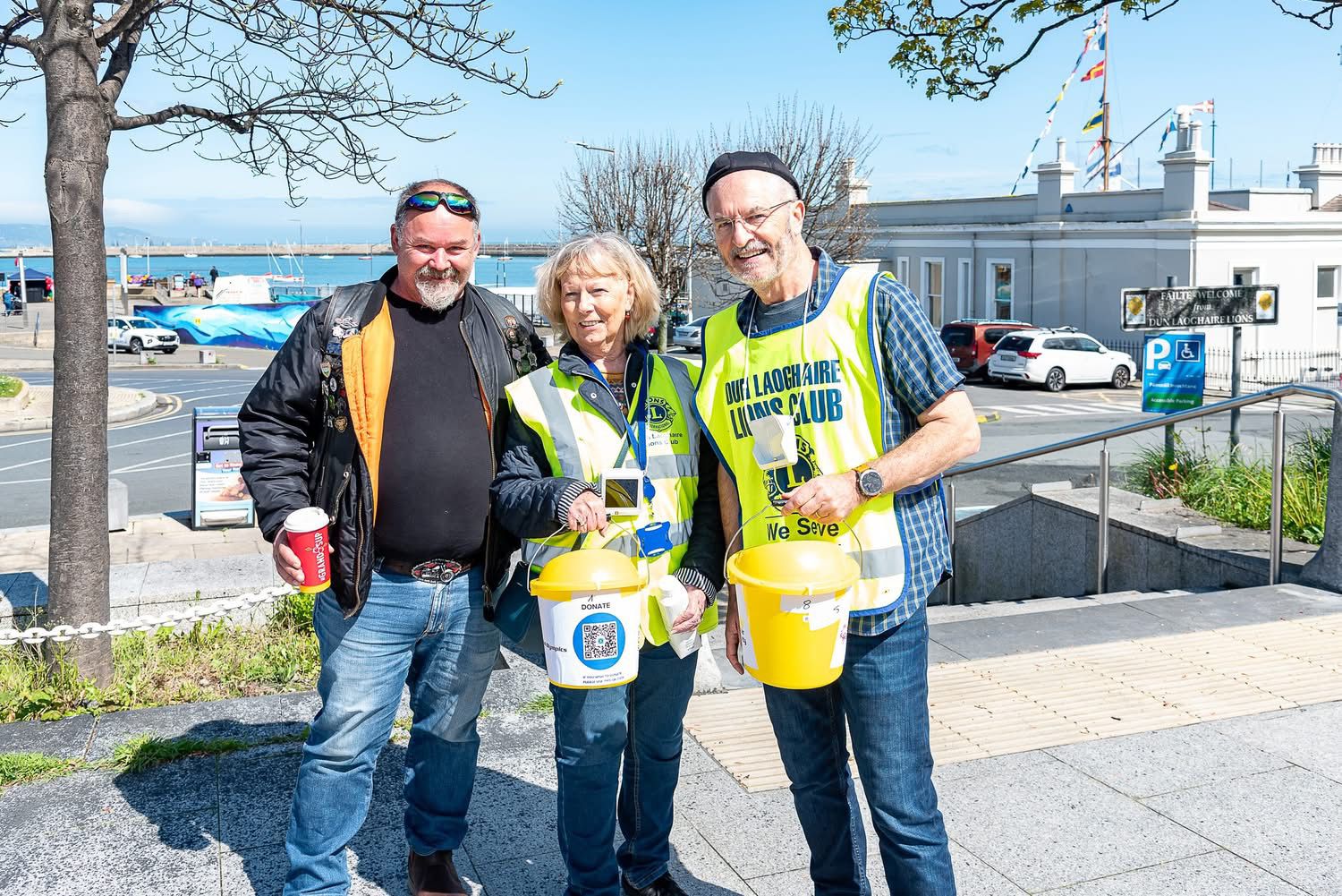 Lions Club volunteers welcoming local residents